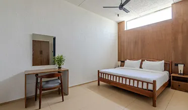 Bedroom with panoramic mountain views at Anaikatti resort